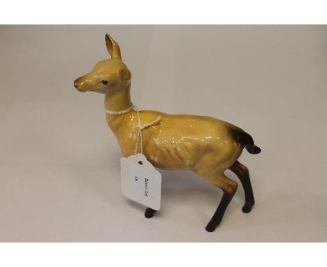 A Beswick Figure : Doe, model 999A, light brow and dark brown, gloss, height 15 cm. 