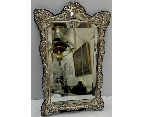 A modern silver framed easel back mirror in the Victorian manner with embossed floral decoration (by Carrs of Sheffield Ltd, 