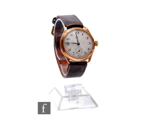 A mid 20th Century 9ct hallmarked manual wind wrist watch, Arabic numerals to a circular dial, diameter 32mm, to a tan leathe