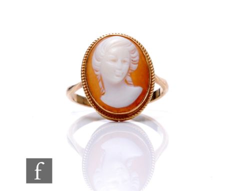 A 9ct cameo ring, head and shoulder study of a woman, weight 2.8g, ring size O 1/2.