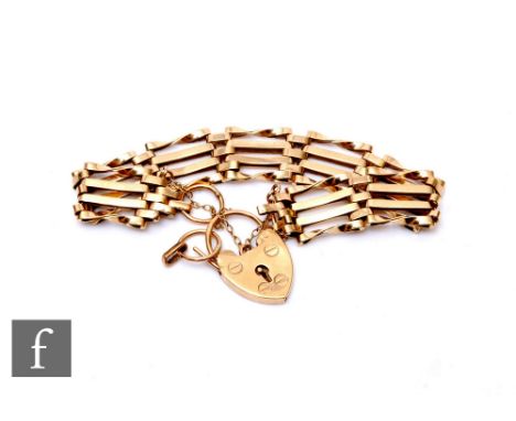 A 9ct hallmarked four bar gate bracelet, weight 12g, terminating in padlock fastener.