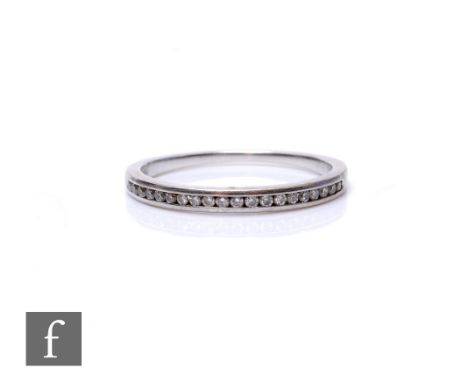 An 18ct white gold diamond half eternity ring, channel set stones to a plain shank, weight 1.6g, ring size K.