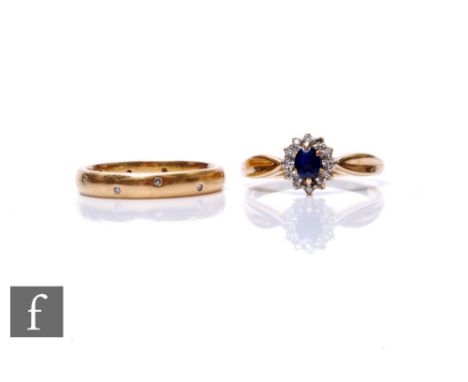 A 9ct hallmarked wedding ring detailed with rub over set diamonds, with 9ct sapphire and diamond cluster ring, total weight 6
