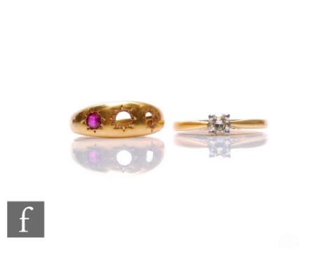 An 18ct diamond solitaire, claw set brilliant cut stone and a damaged 18ct three stone ring, total weight 6g, some damage.
