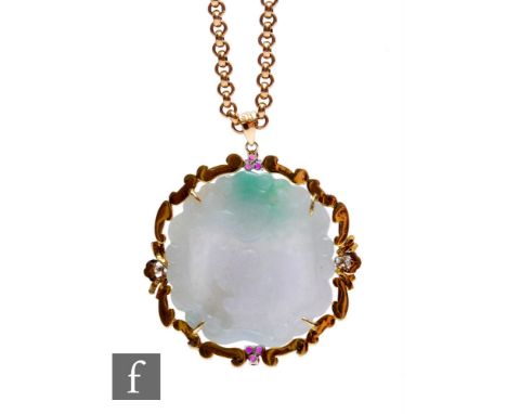 A carved jade circular shaped pendent to a 14ct scroll mount, highlighted with four diamonds and six rubies, weight 48.5g, di