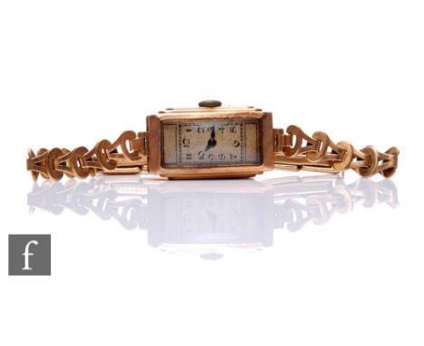 A 9ct hallmarked lady's 9ct manual wind wrist watch, Arabic numerals to a rectangular dial and 9ct bracelet, total weight 12.