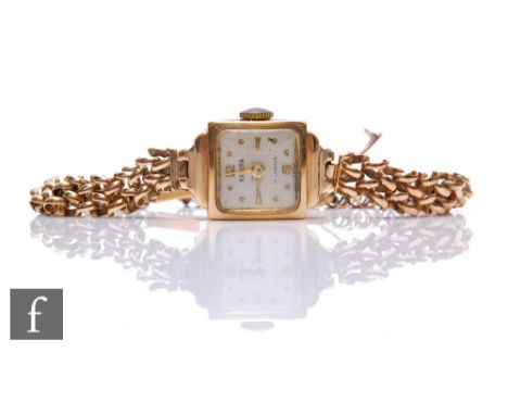 A 9ct hallmarked lady's Bernex manual wind wrist watch, Arabic numerals and batons to a circular dial and a 9ct link bracelet