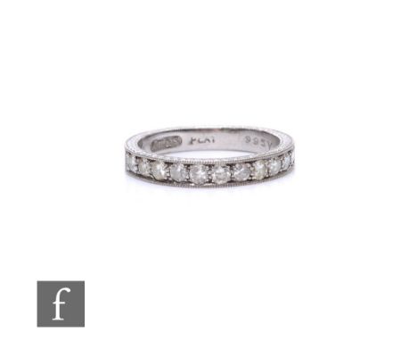 A mid 20th Century platinum diamond half eternity ring comprising eleven claw set stones, weight 4g, ring size L.