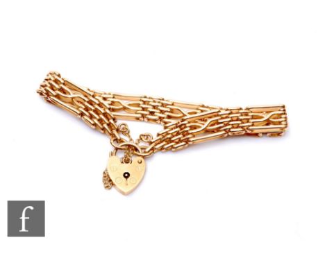 A 9ct hallmarked four bar gate bracelet, weight 21g, terminating in padlock fastener.