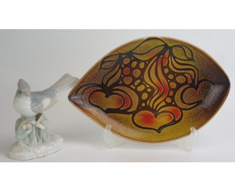 A Poole Pottery Delphis Aegean leaf pattern oval dish, 31cm long, together with a Japanese porcelain figure of a crested finc