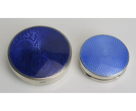 A Sterling silver and enamel circular box, stamped marks, 6.5cm diameter and a smaller example, 5cm diameter,