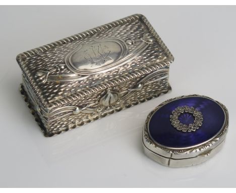 A continental silver and enamel oval box, bears import marks, with steel cut wreath decoration, 4.5cm wide, together with a s