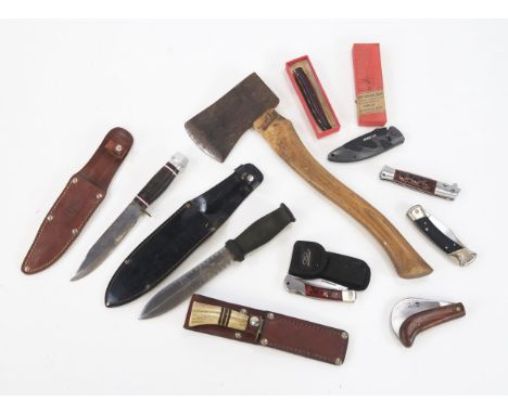 A short axe, assorted folding knives, hunting knives and fishing knives.
