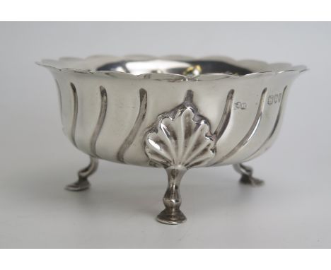 A Victorian silver sugar basin, maker Sibray Hall &amp; Co, London, 1894, with writhen decoration, on three swept feet, 12cm 