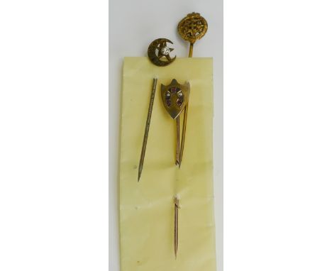 A Ruby and Seed Pearl Shield Shaped Stick Pin and two others