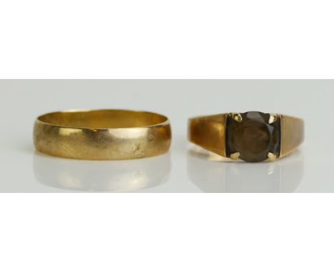 A 9ct Gold Wedding Band (size Q.5, 1.85g) and a 9ct gold and smoky quartz ring (size K.75, 2.65g