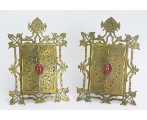 A pair of brass Gothic style easel photograph frames, with fret cut frame with two hinged doors, enclosing a glass panel, 18c