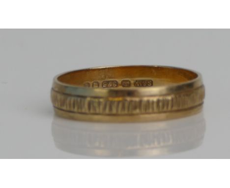 A 9ct Gold Wedding Band with engraved decoration, 4.7mm wide, size R.25, hallmarked, 2.52g