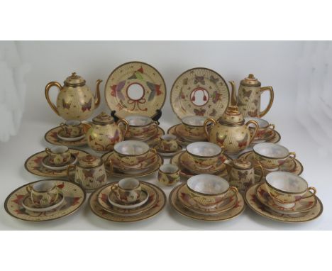 An extensive Noritake eggshell porcelain tea and coffee service, decorated in the Satsuma style with butterflies, includes, e