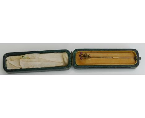 A 15ct Gold and Ruby Stick Pin, stamped 15CT, 1.37g. Boxed