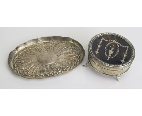 A silver and tortoiseshell inlaid oval dressing table trinket box, all marks worn, raised on four swept feet, 7cm wide, toget