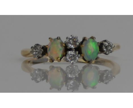 An Antique 18ct Gold, Opal and Old Cut Diamond Six Stone Ring, c. 4.3x3.6mm opals, size M.5, stamped 18CT, 2.17g