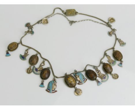 An Antique Egyptian Revival Precious White Metal and Enamel Necklace with carved scarab beetle  pendants and traces of gildin