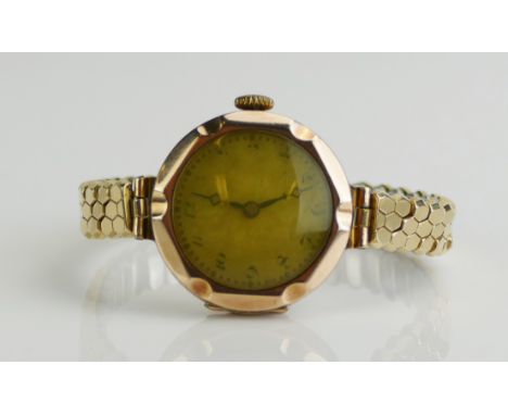 A 9ct Gold Lady's Wristwatch with 25mm case and manual wind VESTA 15 jewel, movement. Running