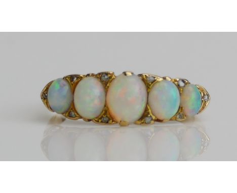 An Antique 18ct Gold, Opal and Rose Cut Diamond Ring, size P.25, rubbed hallmarks, 4.04g