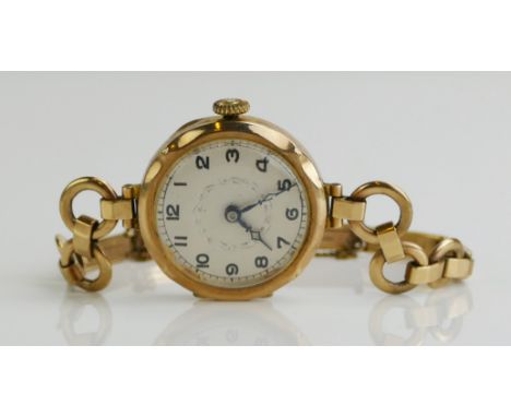 A 9ct Gold Ladies Wristwatch with 25.4mm case and Swiss 15 jewel manual movement and on a Premo 9ct gold spring bracelet, 18.