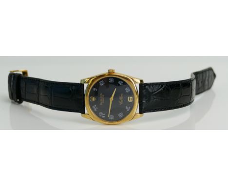 A Rolex Cellini 18K Gold Dress Watch, ref. 4233/B, no. K659246, the 34mm case with black dial and Arabic numerals, manual mec