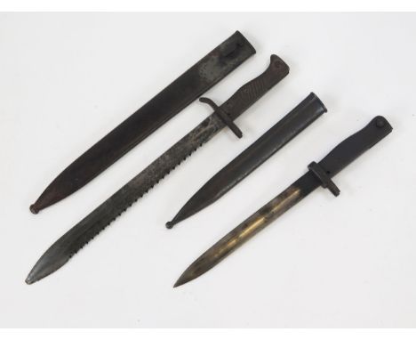 A pioneer's bayonet with 35cm fullered blade with serrated back edge, with metal grip, in a tell scabbard, together with anot