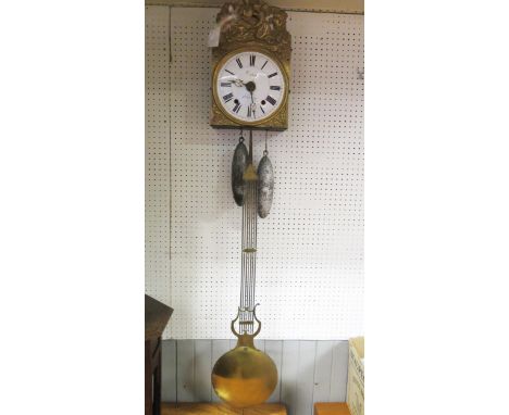 A 19th century French comptoise wall clock, with arched pressed brass dial, with 22cm enamel Roman dial, with grid iron pendu