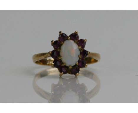 A 9ct Gold, Garnet and Opal Cluster Ring, 12.6x11.2mm head, hallmarked, 2.24g