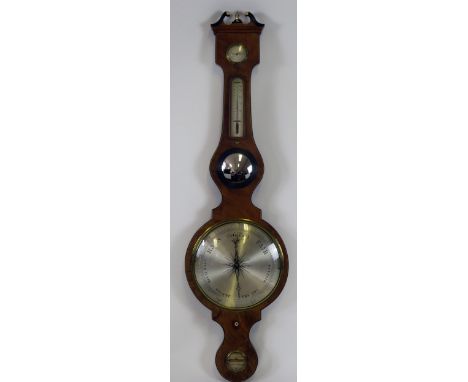 S Salkird, A 19th century mahogany wheel barometer, with broken swan neck pediment, hygrometer, alcohol thermometer, convex m