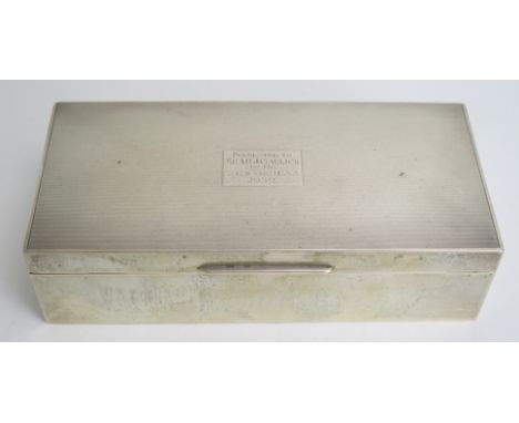 A George V silver cigarette case, maker William Comyns &amp; Sons Ltd, London, 1935, inscribed, of rectangular outline with e