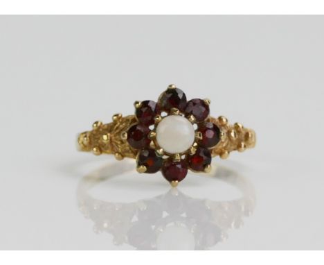 A 9ct Gold, Garnet and Opal Cluster Ring, size L.5, Birmingham marks, 1.89g