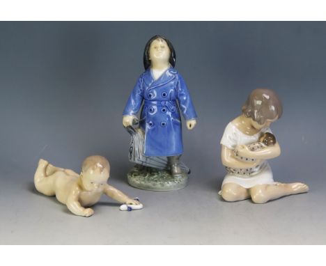 Three Royal Copenhagen porcelain figures, No 3556 Boy with Umbrella, No 1739 Crawling Child, and No 1938 Girl with Doll. (3).