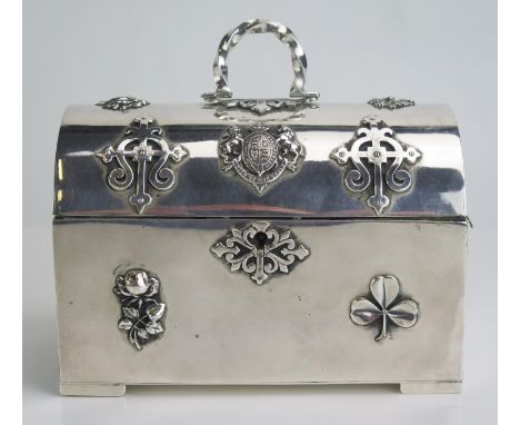 A silver plated trinket casket with domed hinged lid, with velvet lined interior, bears assorted low relief crests, 15cm wide