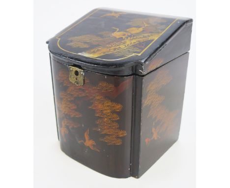 A late 19th century lacquered tea caddy, of bow-front outline decorated in the Chinoiserie taste, 15cm wide, 18cm high