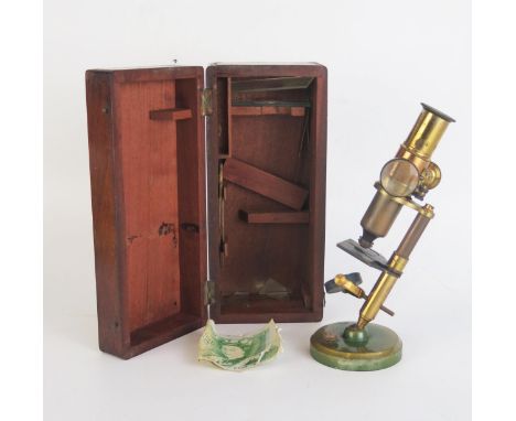 A Small Lacquered Brass Microscope in a mahogany case measuring 22x9.5cm