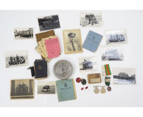 A World War II pair of medals. War and Defence Medals, RAF Service and Release Book, photographs, and an aluminium ashtray ma