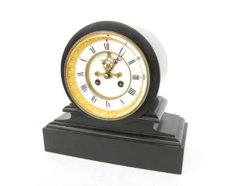 Black slate two train drumhead mantel clock striking on a bell, the 4.75" dial with recessed visible escapement and within a 