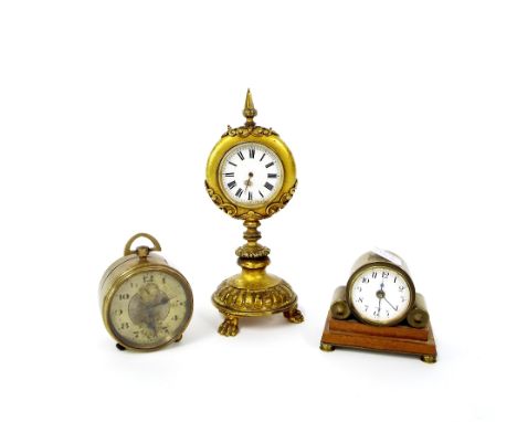 Small gilt metal pedestal mantel clock timepiece, the 2" white dial within a circular case supported upon a turned column and