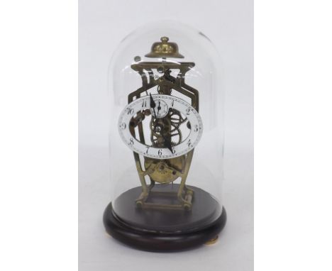 Small reproduction single train skeleton clock, under a glass dome and upon a turned socle, 12" high overall (pendulum)