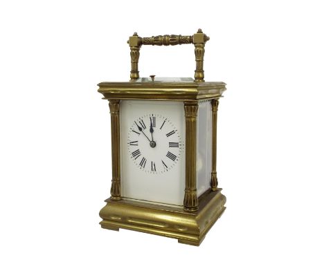 Large repeater carriage clock striking on a gong, within a pillared brass case, 7.75" high