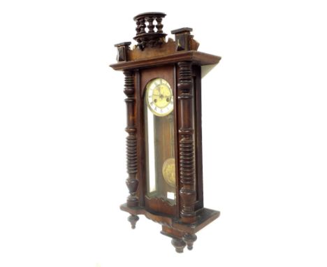 Vienna two train spring driven wall clock striking on a gong, the 5" dial within a pillared glazed case, 37" high