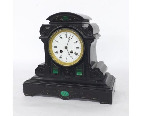 French black slate two train mantel clock striking on a gong, the 4" white dial within a scrolling stepped case inset with ma
