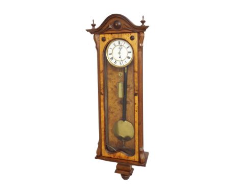 Walnut single weight Vienna regulator wall clock, the 6.25" white dial with subsidiary seconds dial, within a fluted pillared