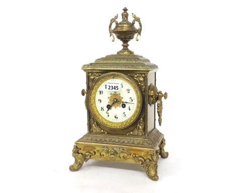 French brass two train mantel clock, the movement with outside countwheel striking on a bell, the 4" cream dial within an orn